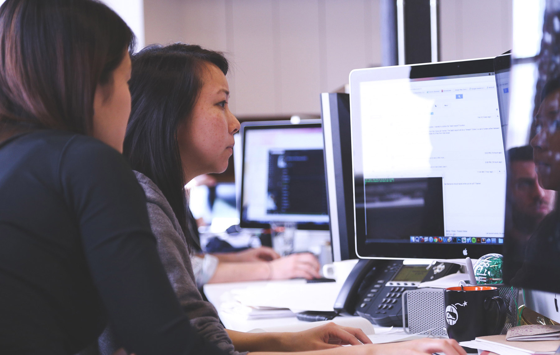 two women working on a computer