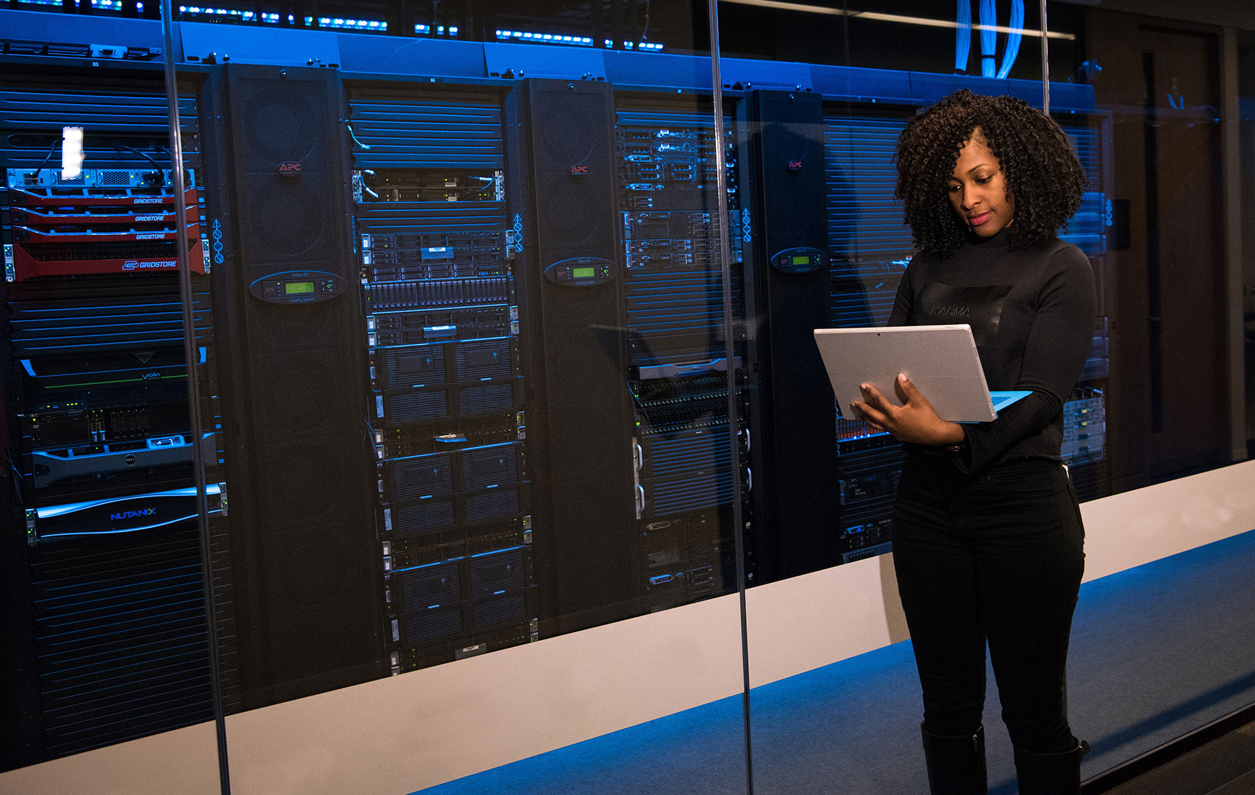 a woman in a data center lab