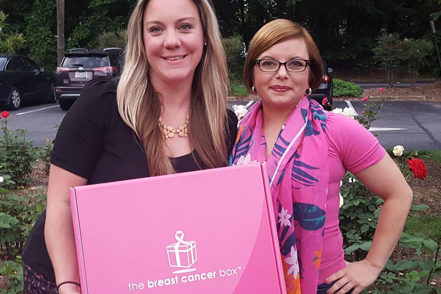 ECS employee with the breast cancer box founder