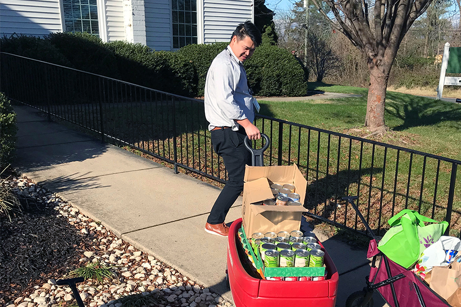 ECS employees donating to a food drive