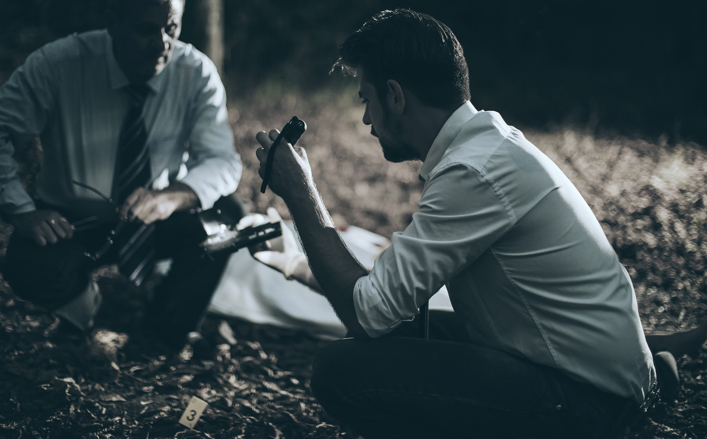Two men looking at a crime scene