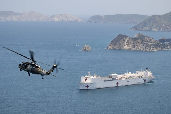190823-N-IA905-1017
SANTA MARTA, Colombia (Aug. 23, 2019) A Colombian army helicopter flies alongside the hospital ship USNS Comfort (T-AH 20) off the coast of Santa Marta, Colombia during a formation flight with the Dragon Whales of Helicopter Sea Combat Squadron (HSC) 28, Aug. 23, 2019. Comfort is working with health and government partners in Central America, South America and the Caribbean to provide care on the ship and at land-based medical sites, helping to relieve pressure on national medical systems strained by an increase in Venezuelan migrants. (U.S. Navy photo by Mass Communication Specialist 2nd Class Morgan K. Nall/Released)